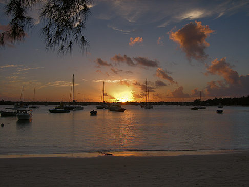 Foto Strand mit Sonnenuntergang - 